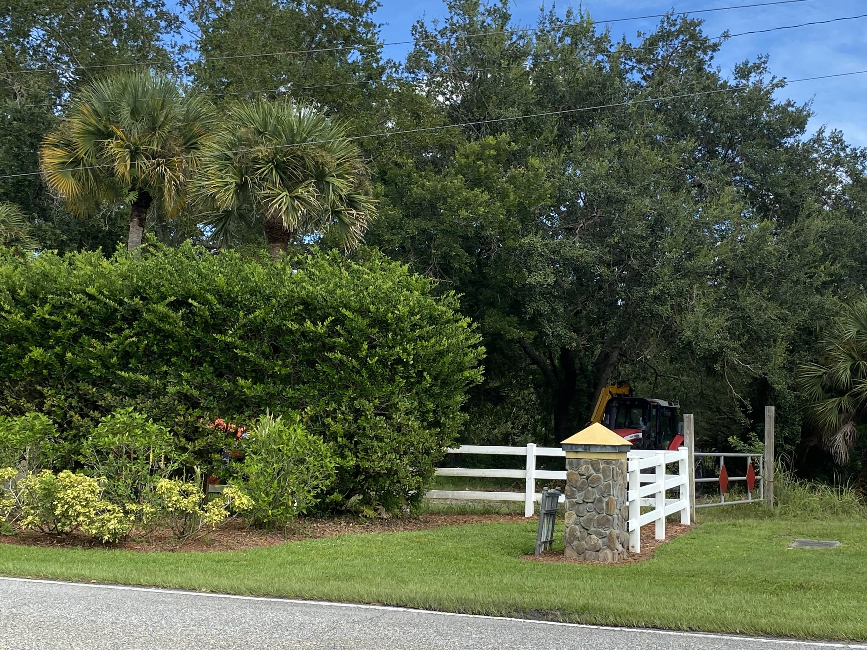 192 Deer Run Road Palm Bay, FL 32909 - Photo 3 of 7 a view of a chair and table in the garden