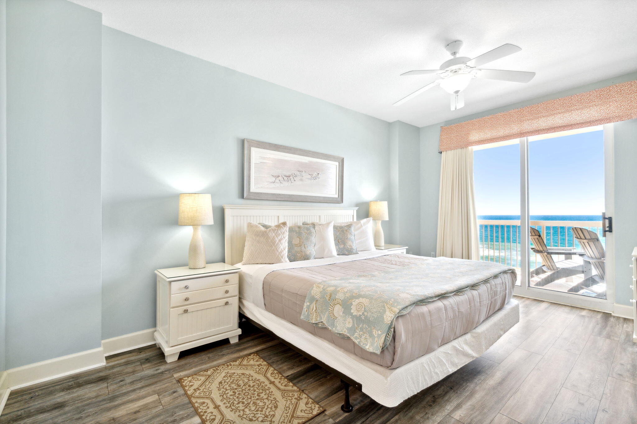 14825 Front Beach Road, Unit 1204 Panama City Beach, FL 32413 - Photo 2 of 13 a bedroom with a large bed and a chandelier