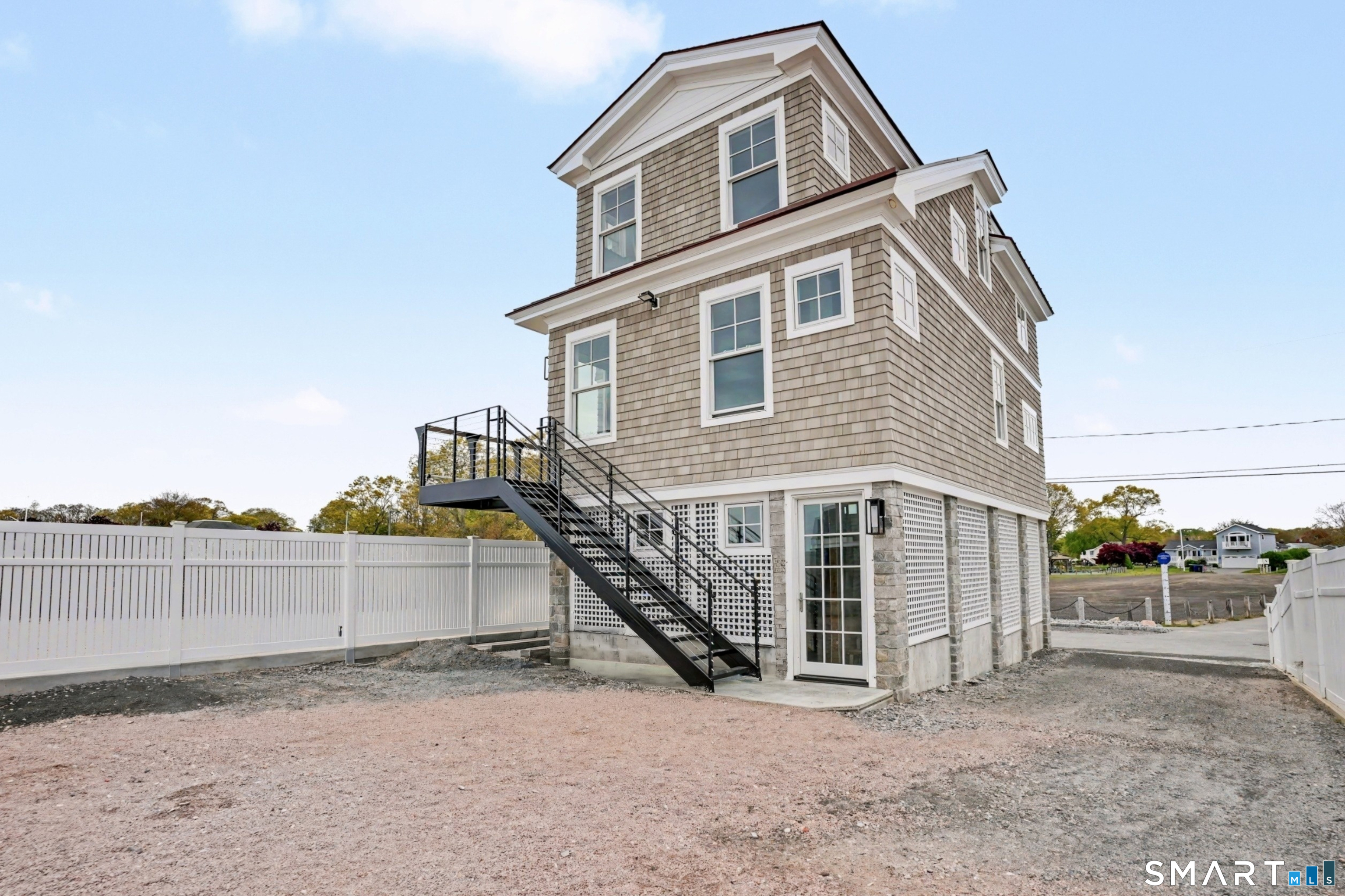 40 Pond Road Old Lyme, CT 06371 - Photo 17 of 35 a view of a house with a yard and fence