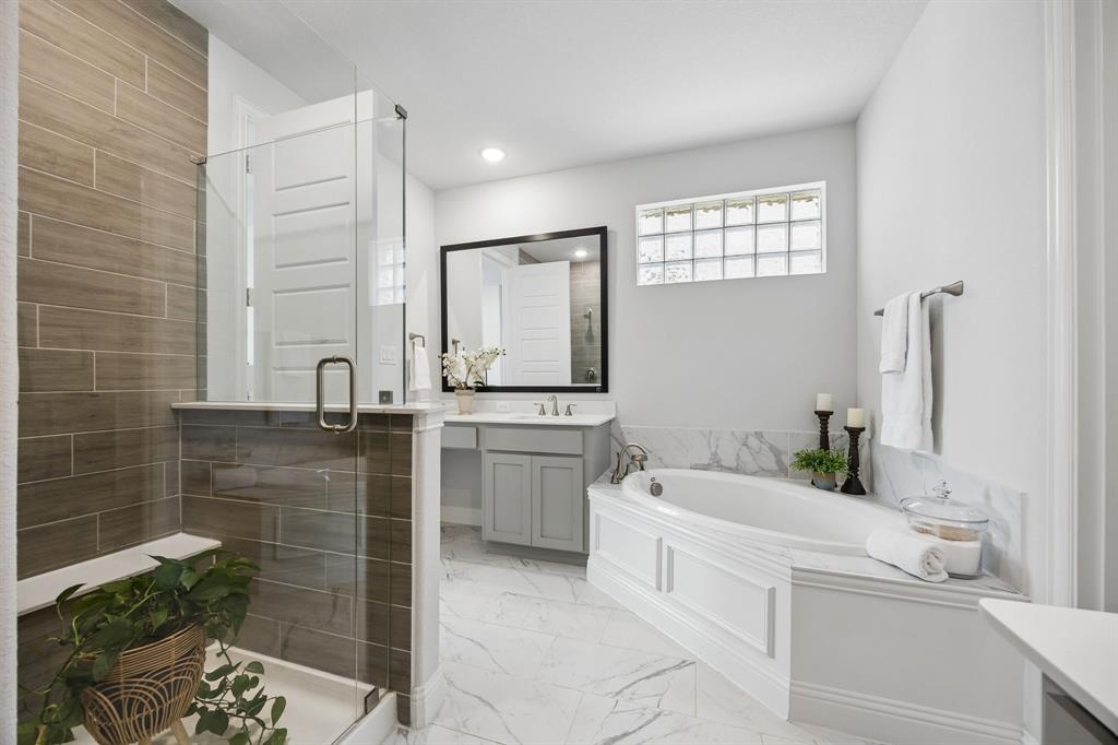15804 Shasta Daisy Road Frisco, TX 75035 - Photo 13 of 36 Spa-like primary bathroom with spacious shower and garden tub.
