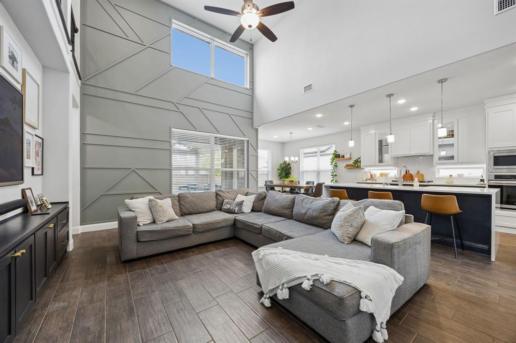 15804 Shasta Daisy Road Frisco, TX 75035 - Photo 7 of 36 Living room and kitchen are open to one another creating an inviting space for entertaining!