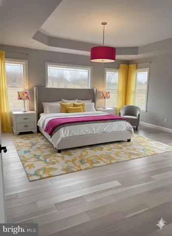 a bedroom with a bed and window