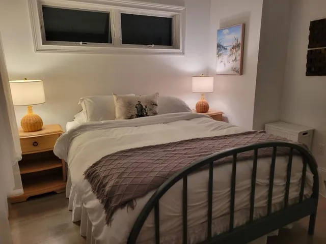 a bedroom with a bed and a television