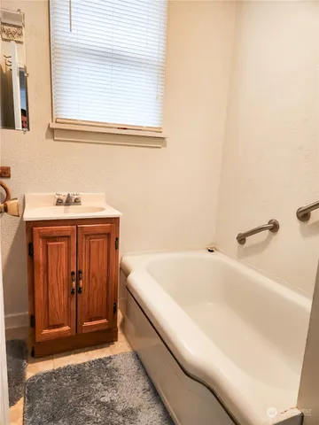 a bathroom with a sink and a bathtub
