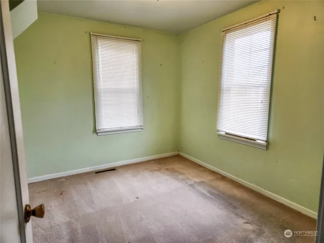 a view of a room that has a window in it