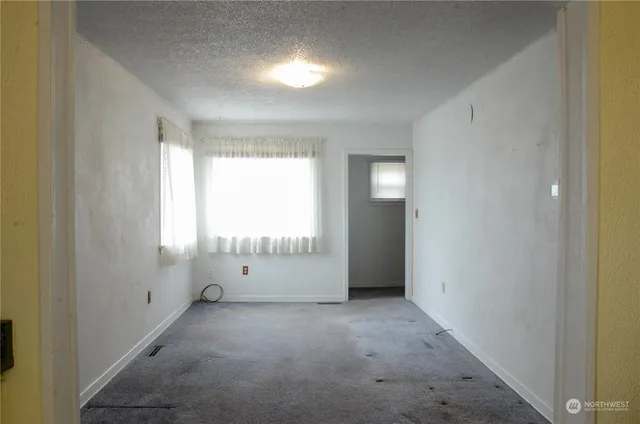 a view of an empty room with a window