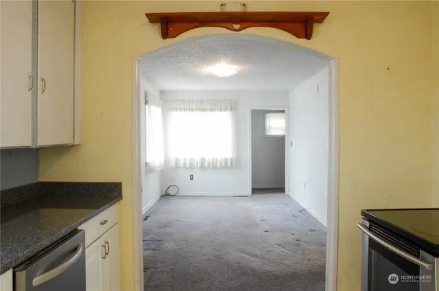 a view of a kitchen cabinets and a stove