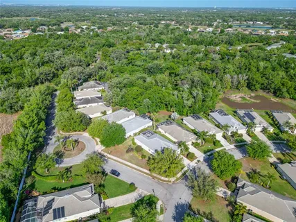 an aerial view of residential houses with outdoor space