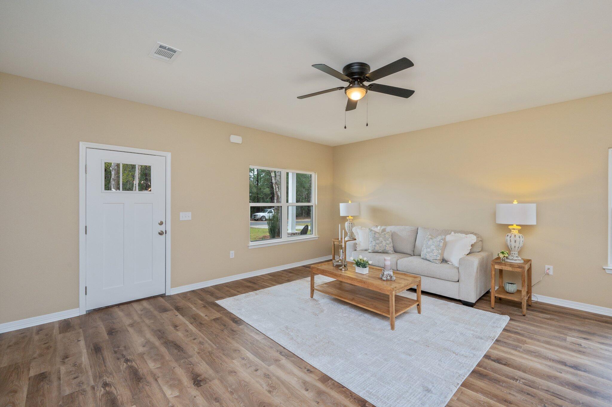 6027 Sand Hill Road Crestview, FL 32539 - Photo 8 of 42 a living room with furniture and a window