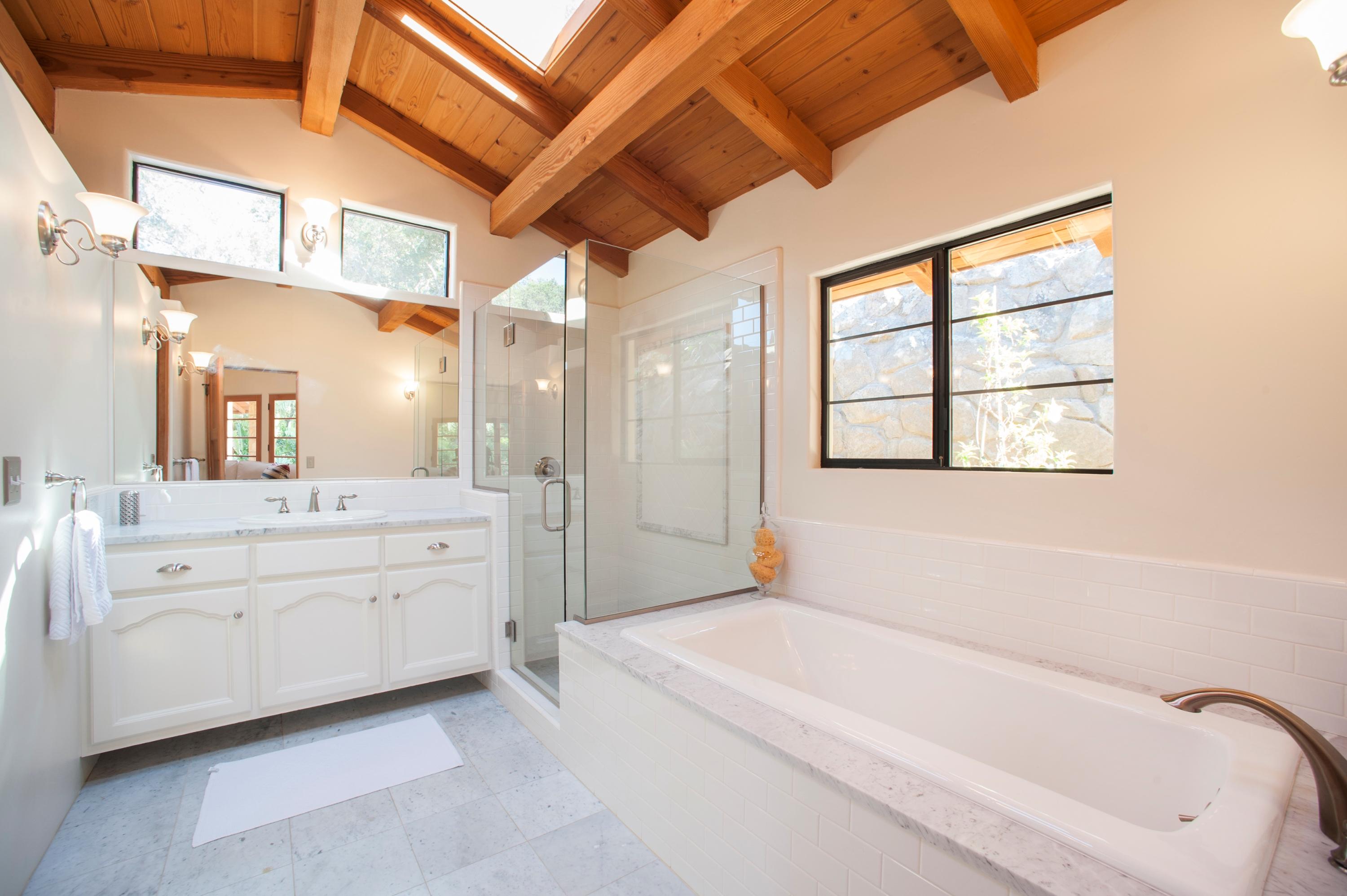 398 Mountain Drive Santa Barbara, CA 93103 - Photo 19 of 28 a spacious bathroom with a tub sink and mirror