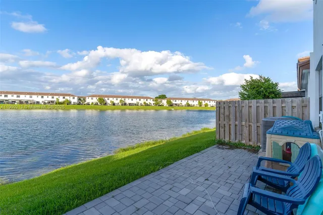 a front view of a house with a yard and a garage