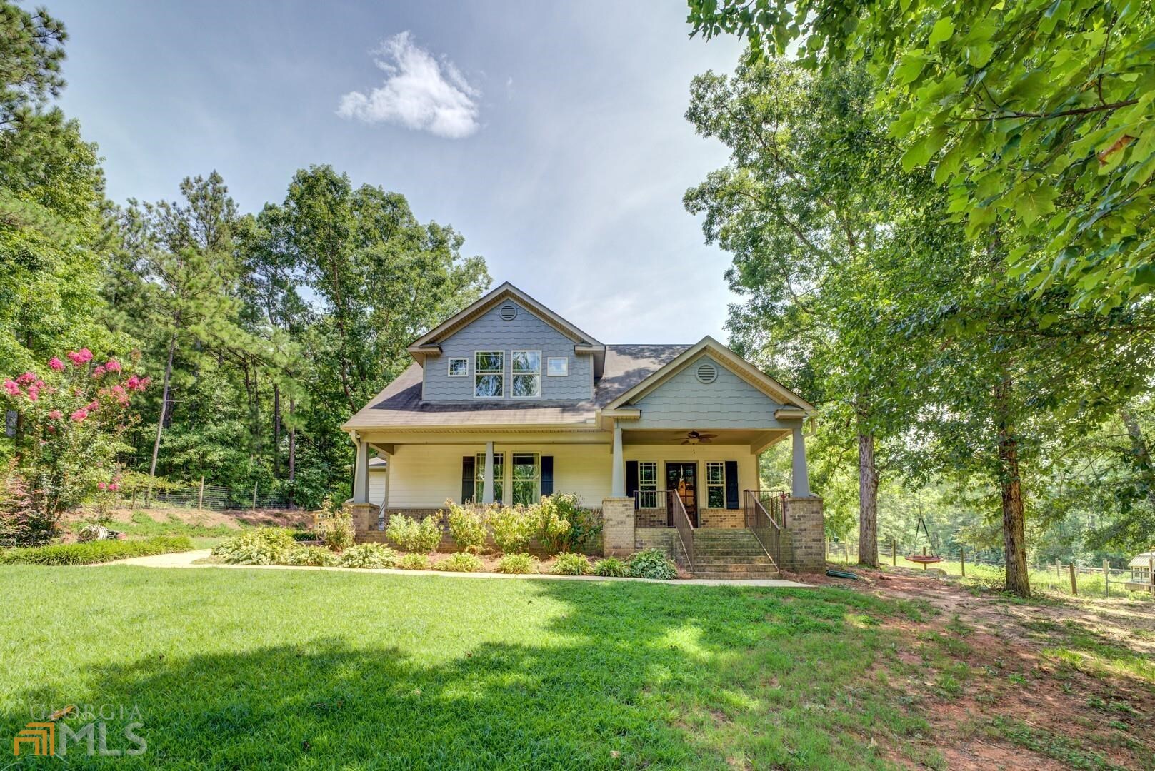 255 Digby Road Covington, GA 30014 - Photo 1 of 1 a front view of a house with a garden