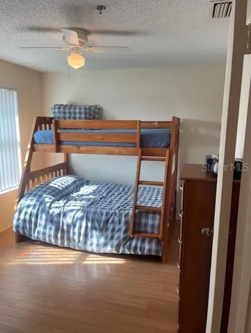 a bedroom with a bed and cabinets