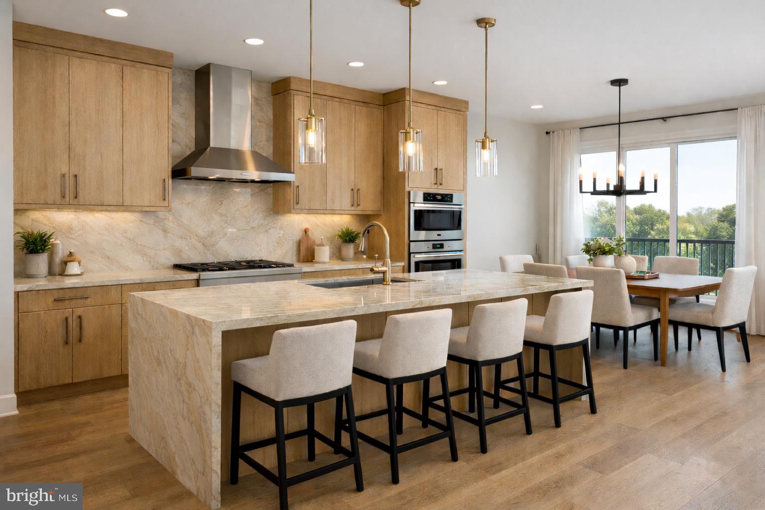15 Kennedy Way Warminster, PA 18974 - Photo 5 of 11 a kitchen with kitchen island granite countertop a table chairs sink and cabinets