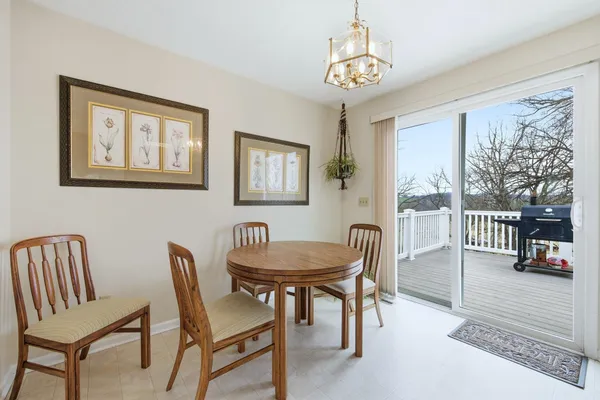 a kitchen with stainless steel appliances granite countertop a sink dishwasher stove and wooden cabinets