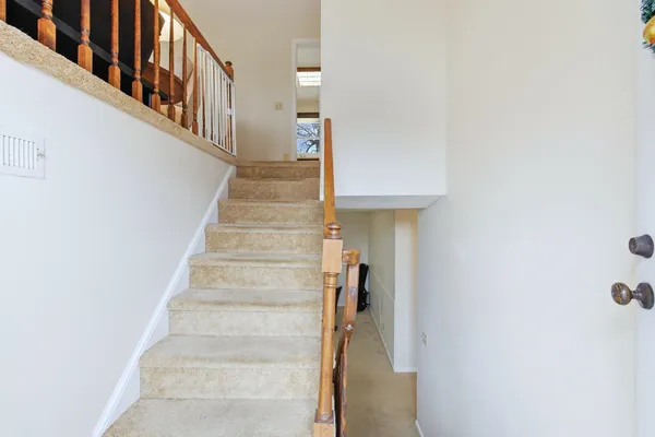 a view of a workspace with furniture and a fireplace