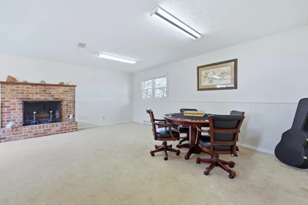 a view of an empty room with a fireplace