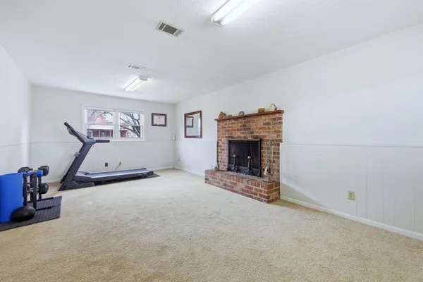 a view of fireplace and window