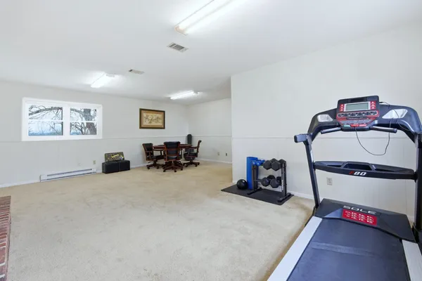 a view of a workspace with furniture and a workspace