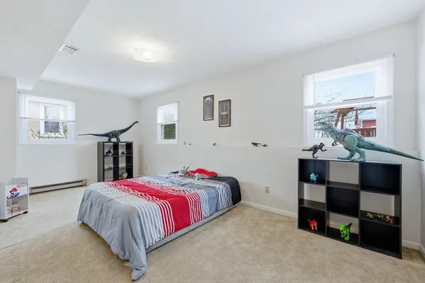 a bedroom with a bed and a couch