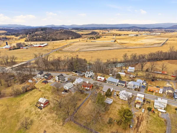 an aerial view of residential building and ocean