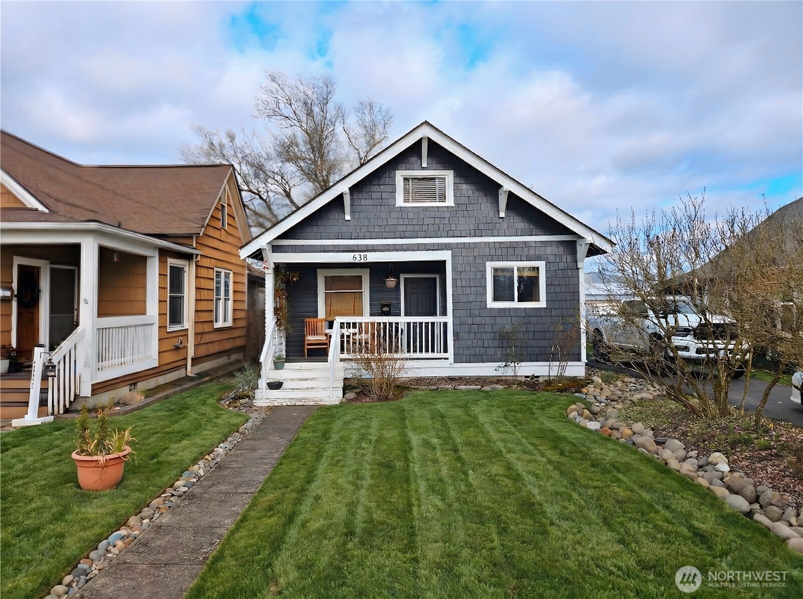638 Northwest Folsom Street Chehalis, WA 98532 - Photo 1 of 12 a front view of a house with a yard and porch