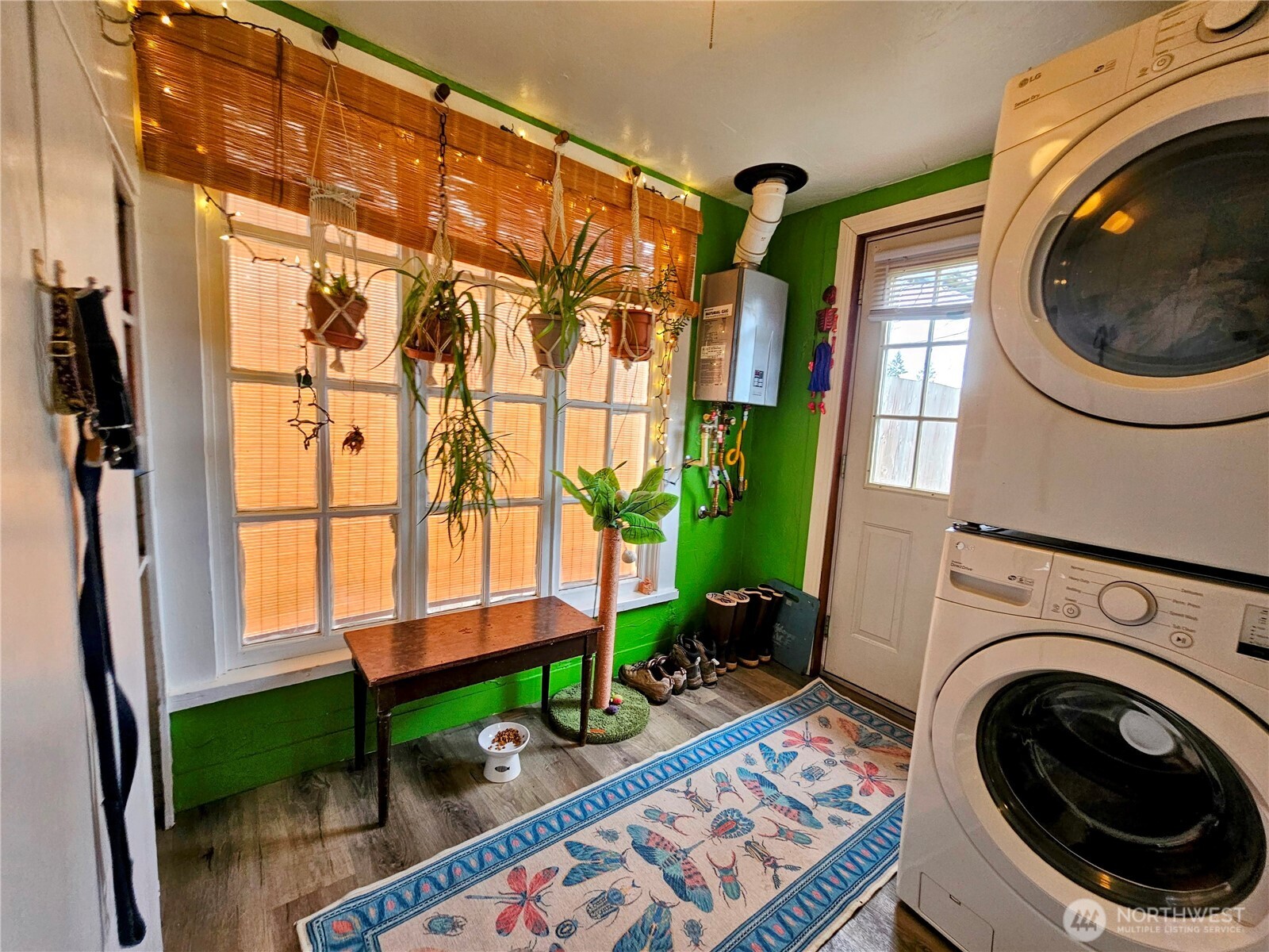 638 Northwest Folsom Street Chehalis, WA 98532 - Photo 11 of 12 a utility room with painting on the wall and a potted plant