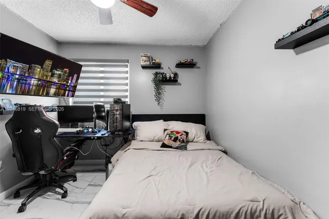 a bedroom with a bed and a book shelf