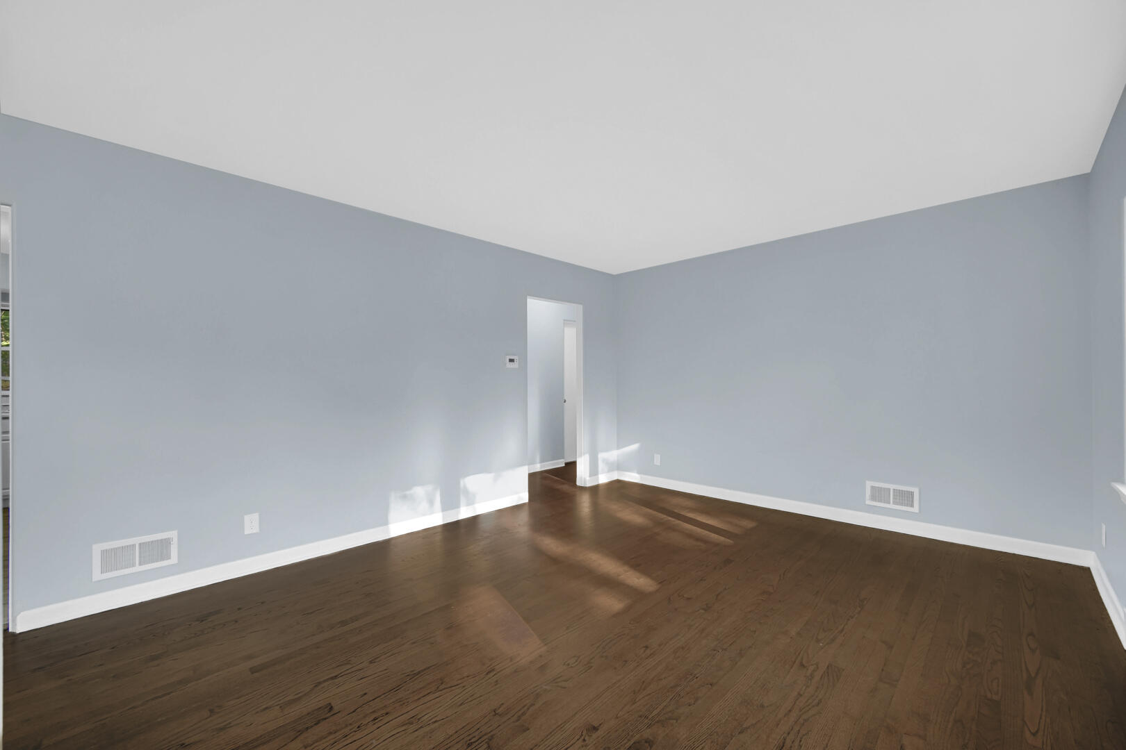 3816 Lincoln Street Gary, IN 46408 - Photo 4 of 21 a view of an empty room with wooden floor
