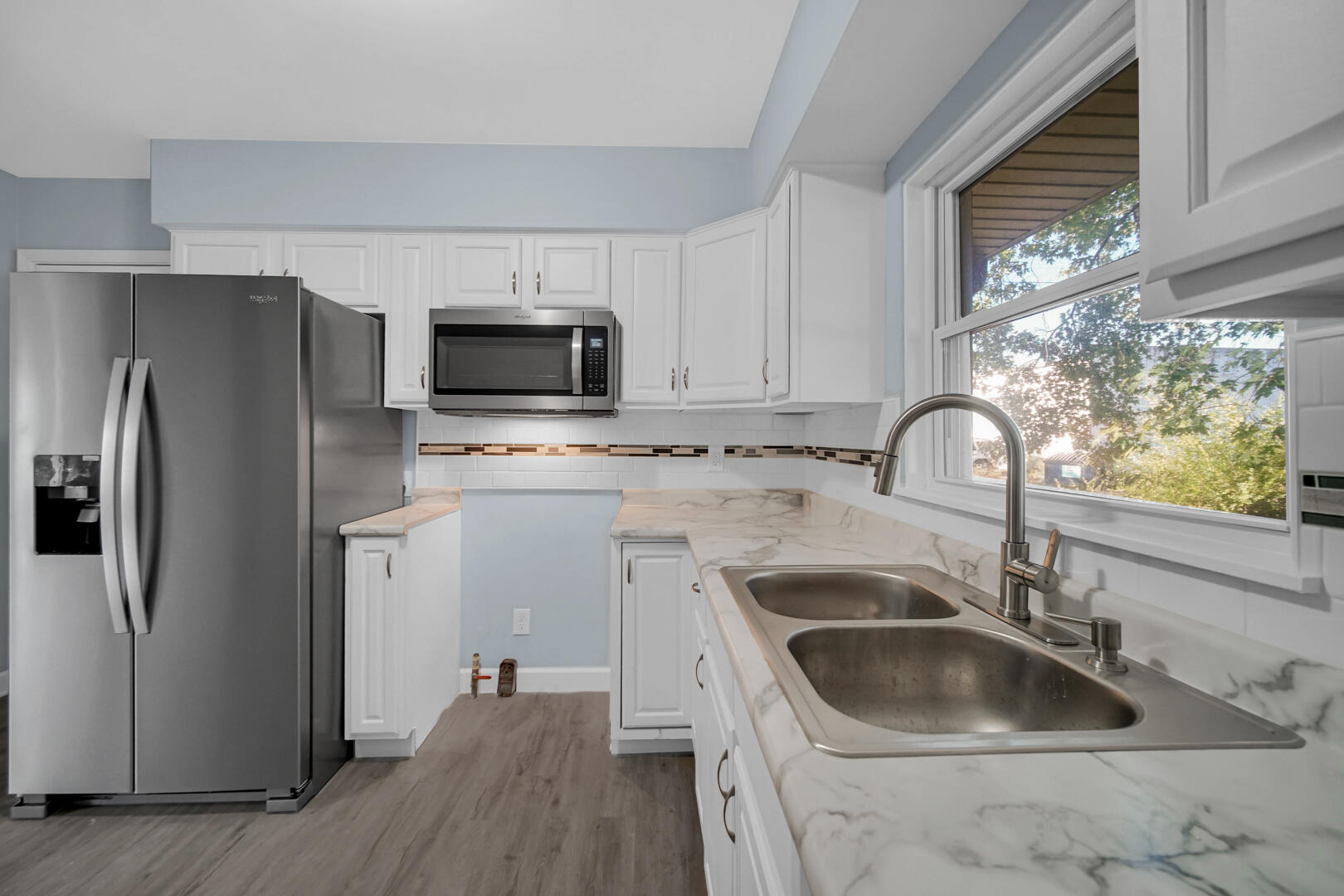 3816 Lincoln Street Gary, IN 46408 - Photo 8 of 21 a kitchen with a sink cabinets and stainless steel appliances