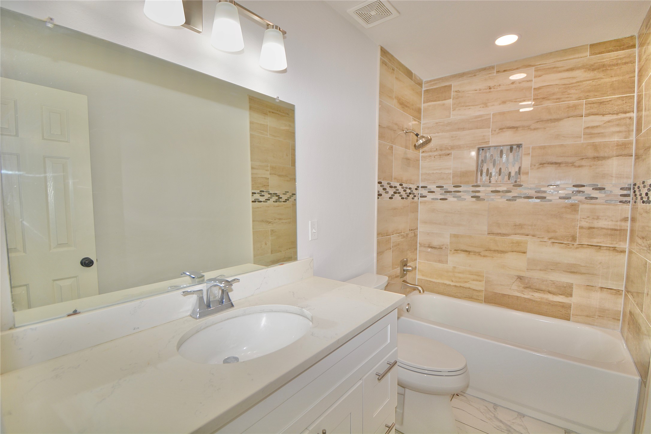 2020 Ward Street Rosenberg, TX 77471 - Photo 14 of 19 a bathroom with a granite countertop sink a toilet and shower