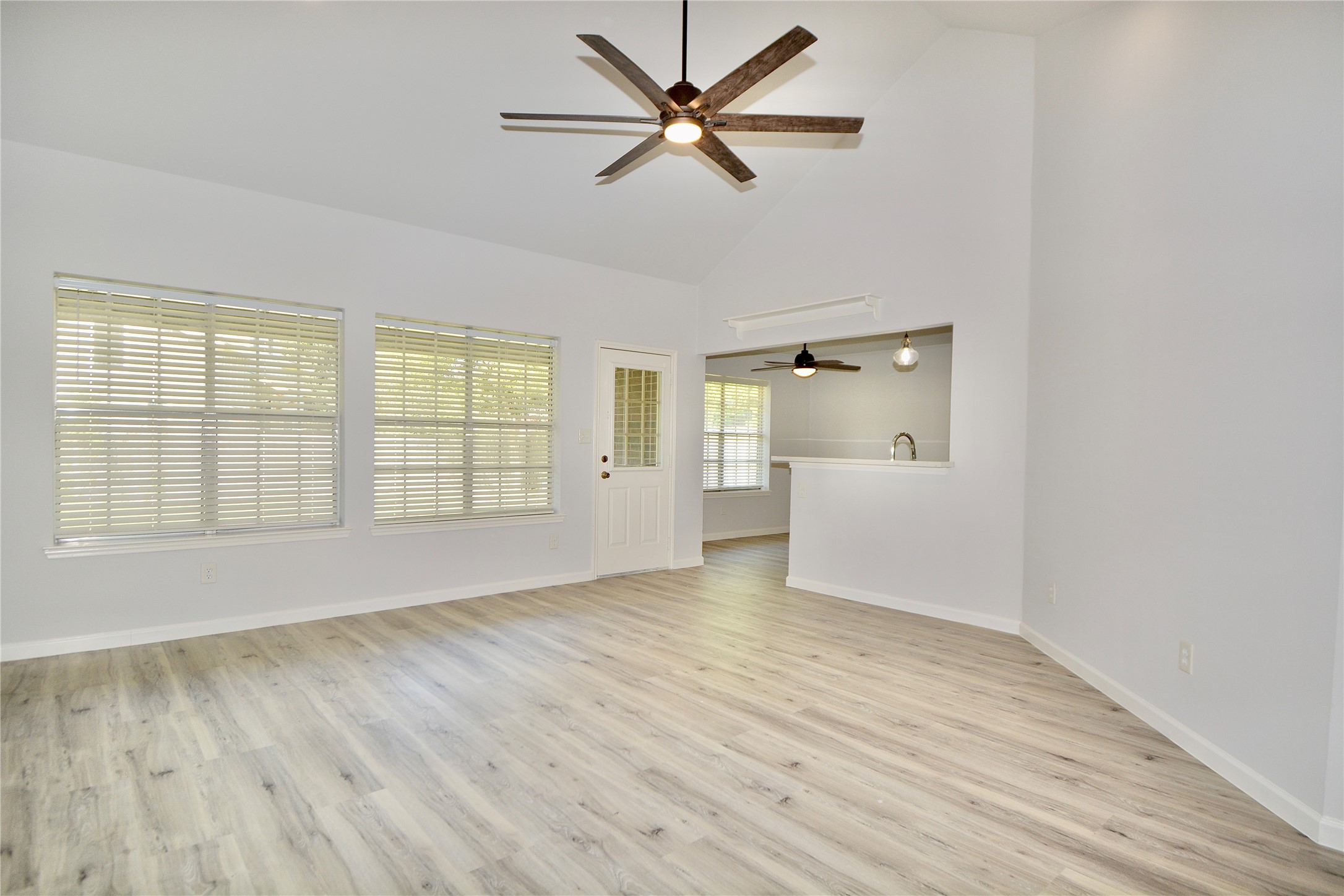 2020 Ward Street Rosenberg, TX 77471 - Photo 2 of 19 a view of an empty room with a window and wooden floor
