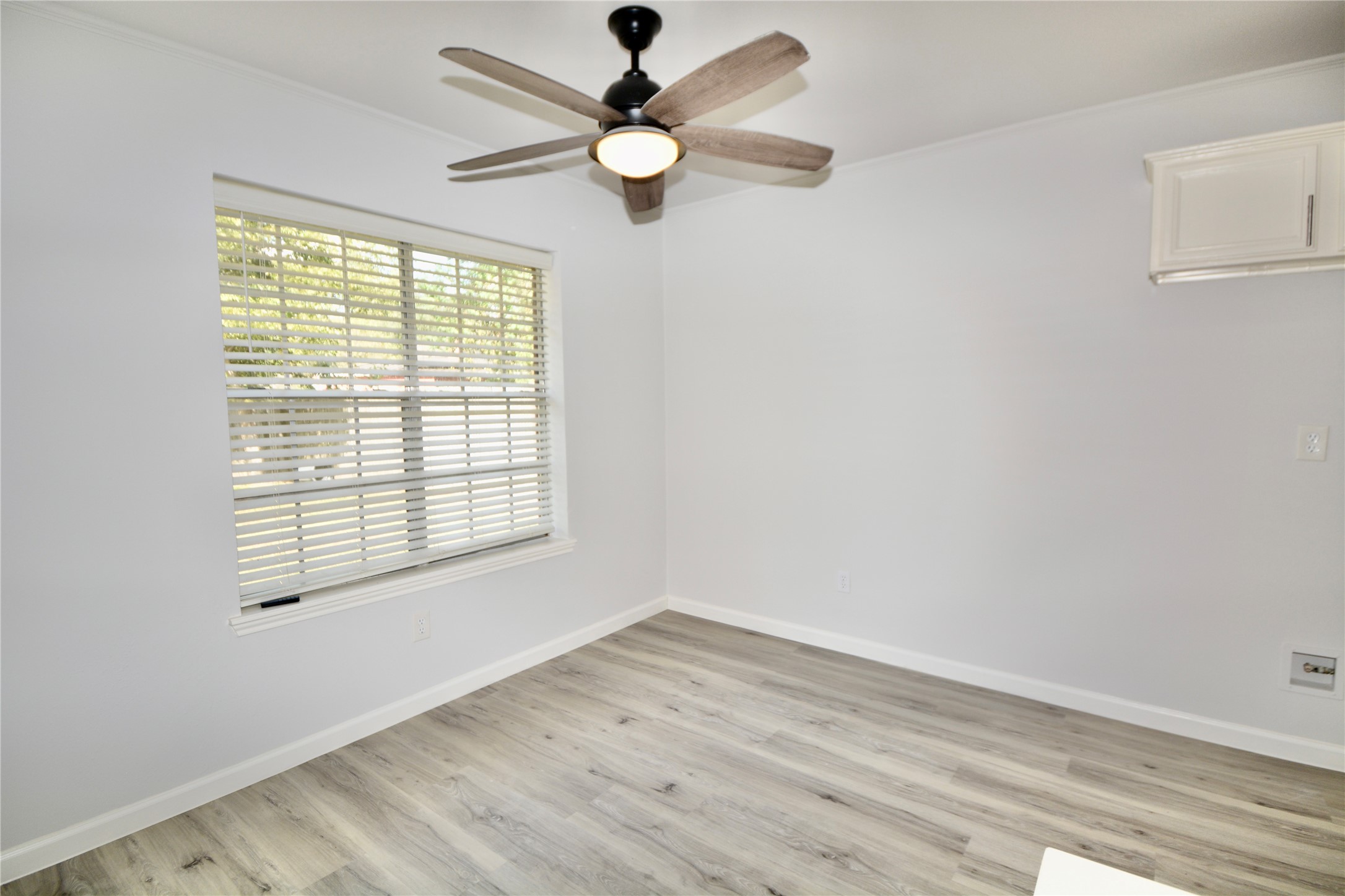 2020 Ward Street Rosenberg, TX 77471 - Photo 4 of 19 a view of an empty room with wooden floor and a window