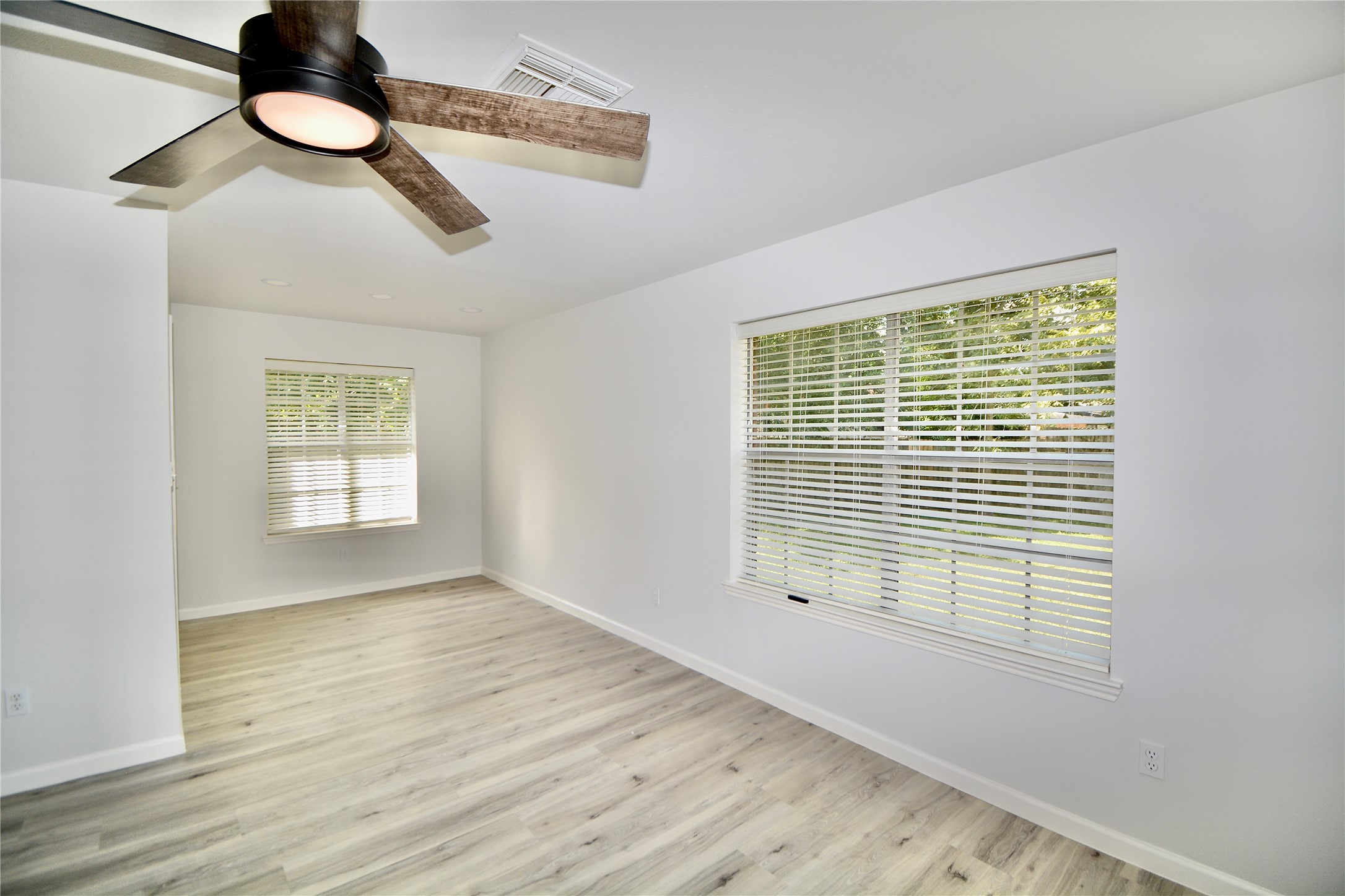 2020 Ward Street Rosenberg, TX 77471 - Photo 10 of 19 a view of an empty room with wooden floor and a window