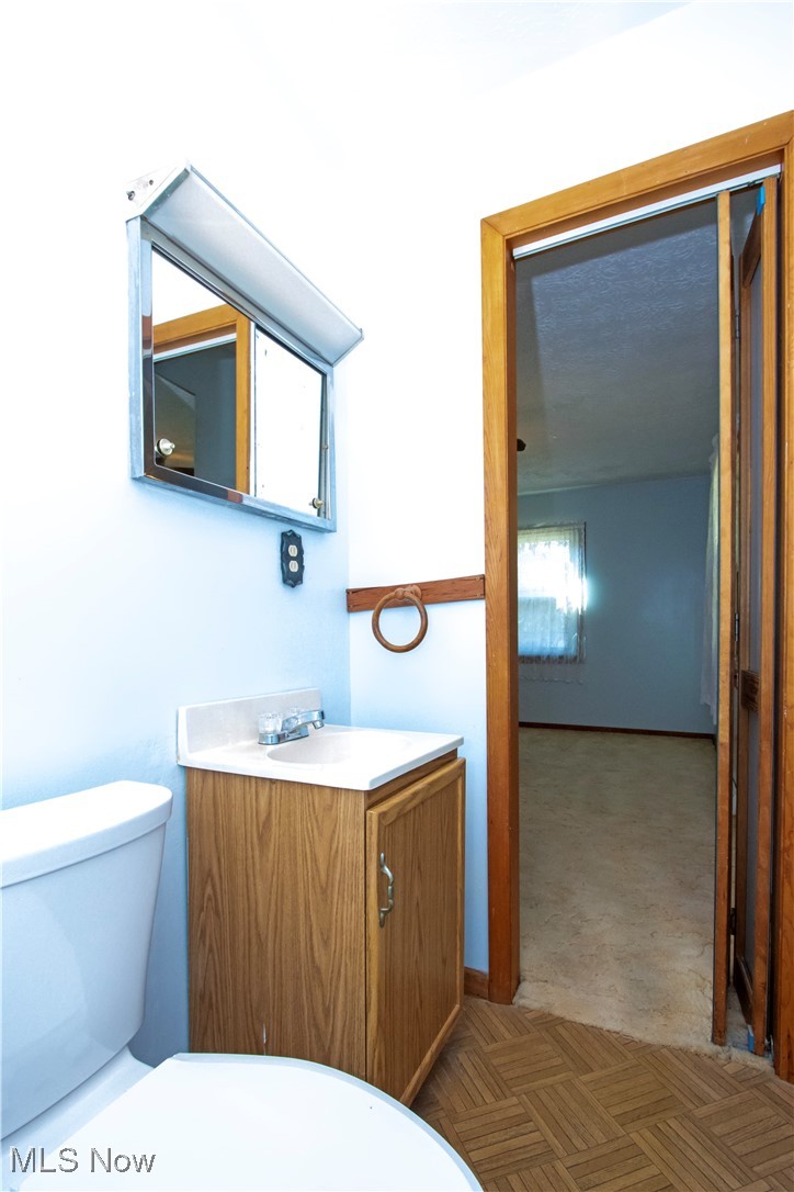 12950 Shank Road Doylestown, OH 44230 - Photo 13 of 27 Bathroom with vanity and toilet