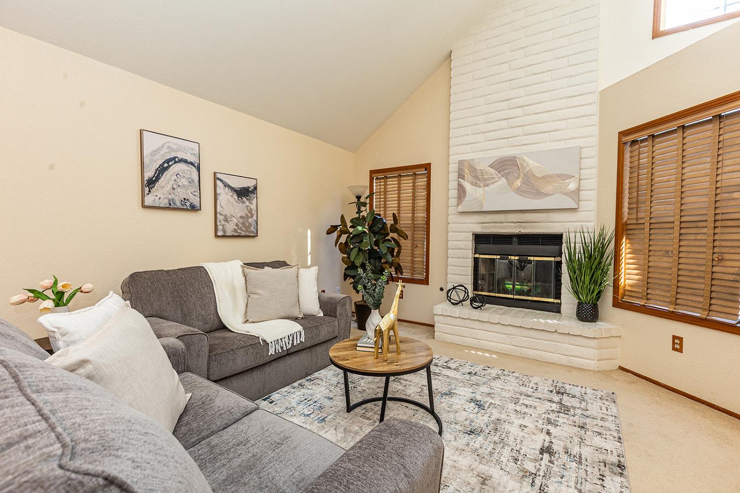 3913 Cougar Place Modesto, CA 95356 - Photo 13 of 40 a living room with furniture and a fireplace