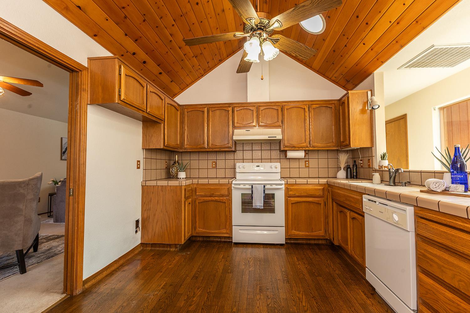 3913 Cougar Place Modesto, CA 95356 - Photo 14 of 40 a kitchen with white cabinets and white appliances