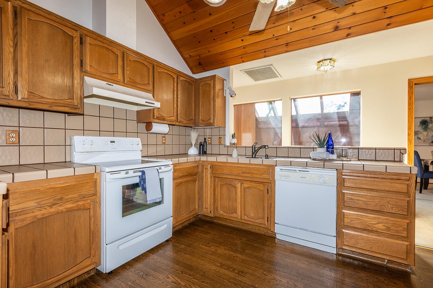 3913 Cougar Place Modesto, CA 95356 - Photo 17 of 40 a kitchen with a stove sink and cabinets