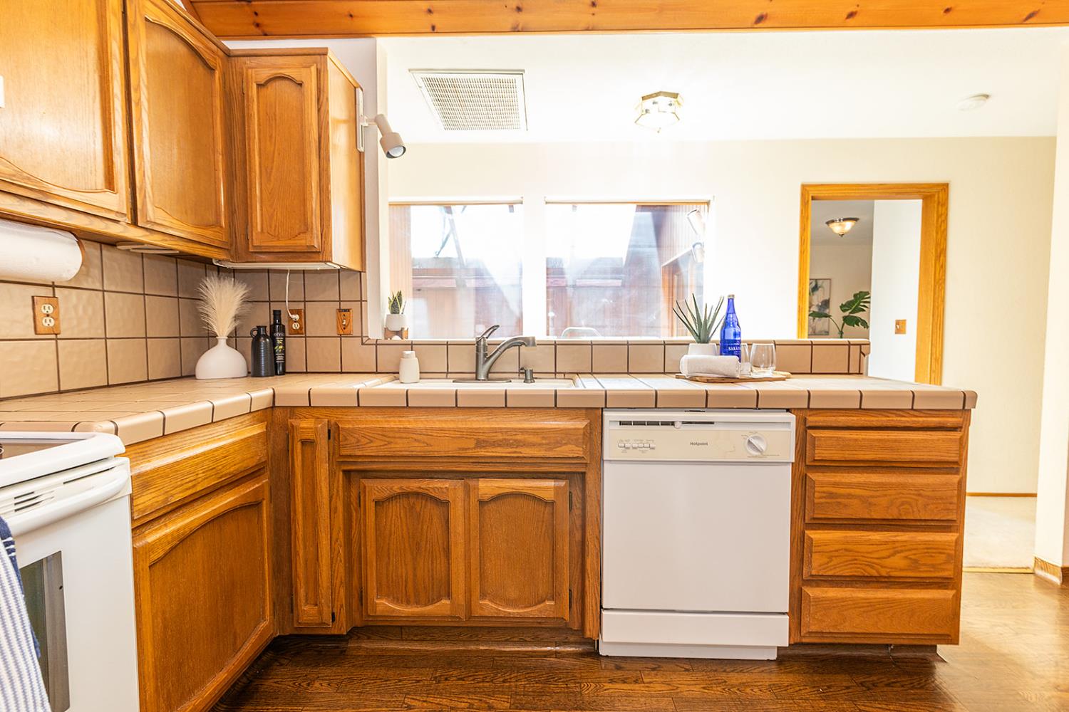 3913 Cougar Place Modesto, CA 95356 - Photo 19 of 40 a kitchen with a sink and cabinets