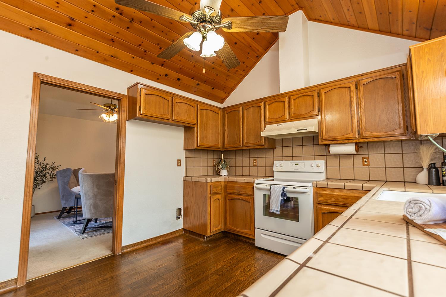 3913 Cougar Place Modesto, CA 95356 - Photo 21 of 40 a kitchen with stainless steel appliances granite countertop a stove a refrigerator and a microwave