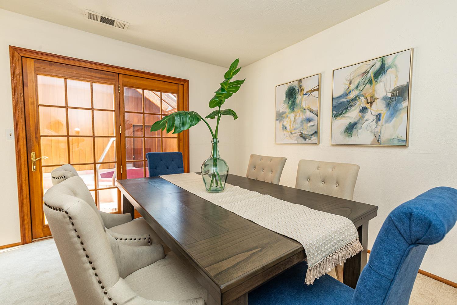 3913 Cougar Place Modesto, CA 95356 - Photo 23 of 40 a bedroom with a bed and a table with potted plant on it