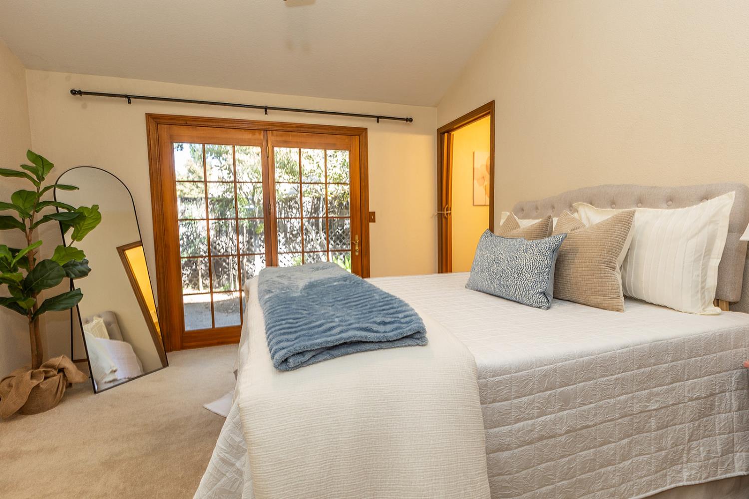 3913 Cougar Place Modesto, CA 95356 - Photo 30 of 40 a bedroom with a balcony a bed and a large window