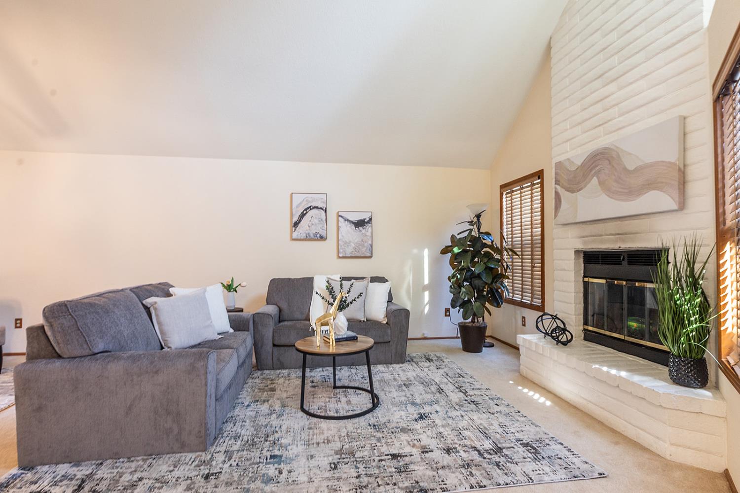 3913 Cougar Place Modesto, CA 95356 - Photo 6 of 40 a living room with furniture and a fireplace