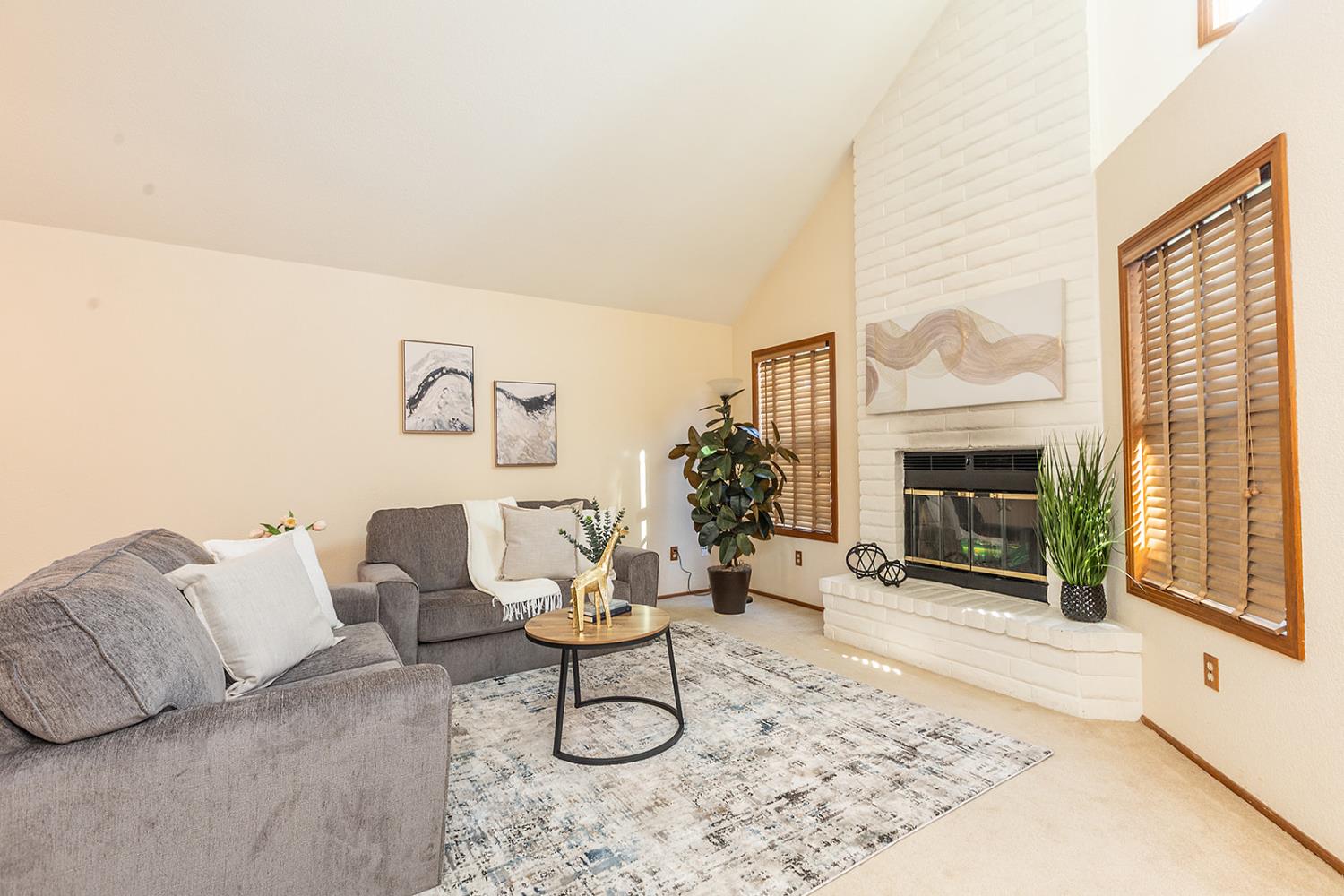 3913 Cougar Place Modesto, CA 95356 - Photo 7 of 40 a living room with furniture and a fireplace