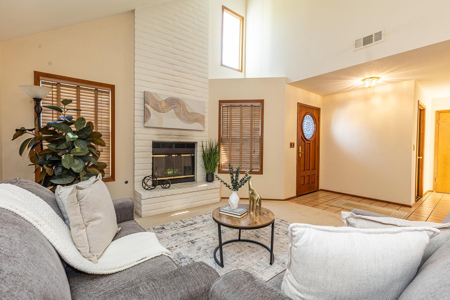3913 Cougar Place Modesto, CA 95356 - Photo 10 of 40 a living room with furniture and a fireplace