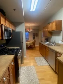 a view of walk in closet with window and shower
