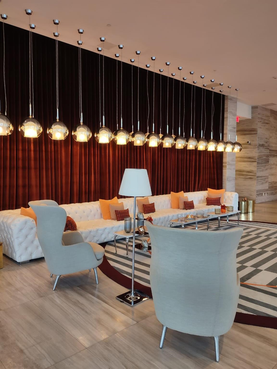 2000 Metropica Way, Unit 507 Sunrise, FL 33323 - Photo 2 of 13 a living room with furniture a table and wooden floor