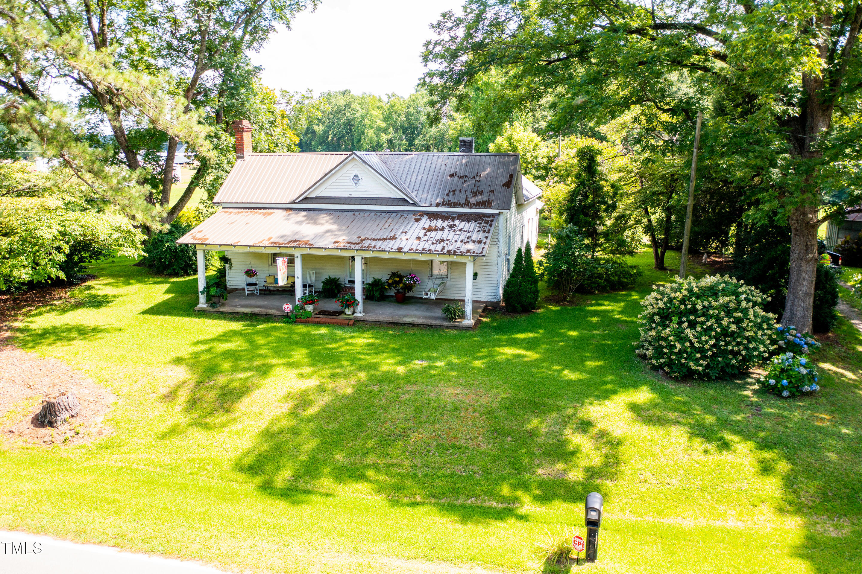 7167 Adolph Road Bailey, NC 27807 - Photo 2 of 18 a view of a house with a big yard and large trees