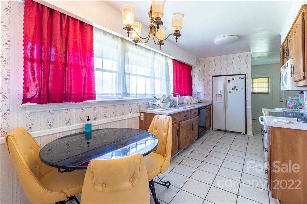 910 Bridlepath Lane Charlotte, NC 28211 - Photo 3 of 5 a kitchen with a sink cabinets and window