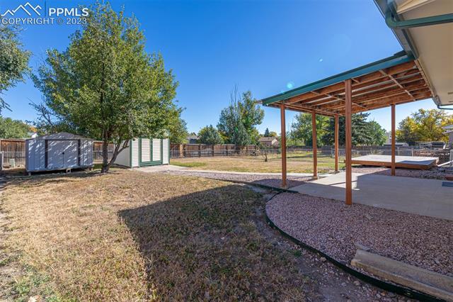 1775 Winnebago Road Colorado Springs, CO 80915 - Photo 21 of 32 Side view of backyard. covered porch